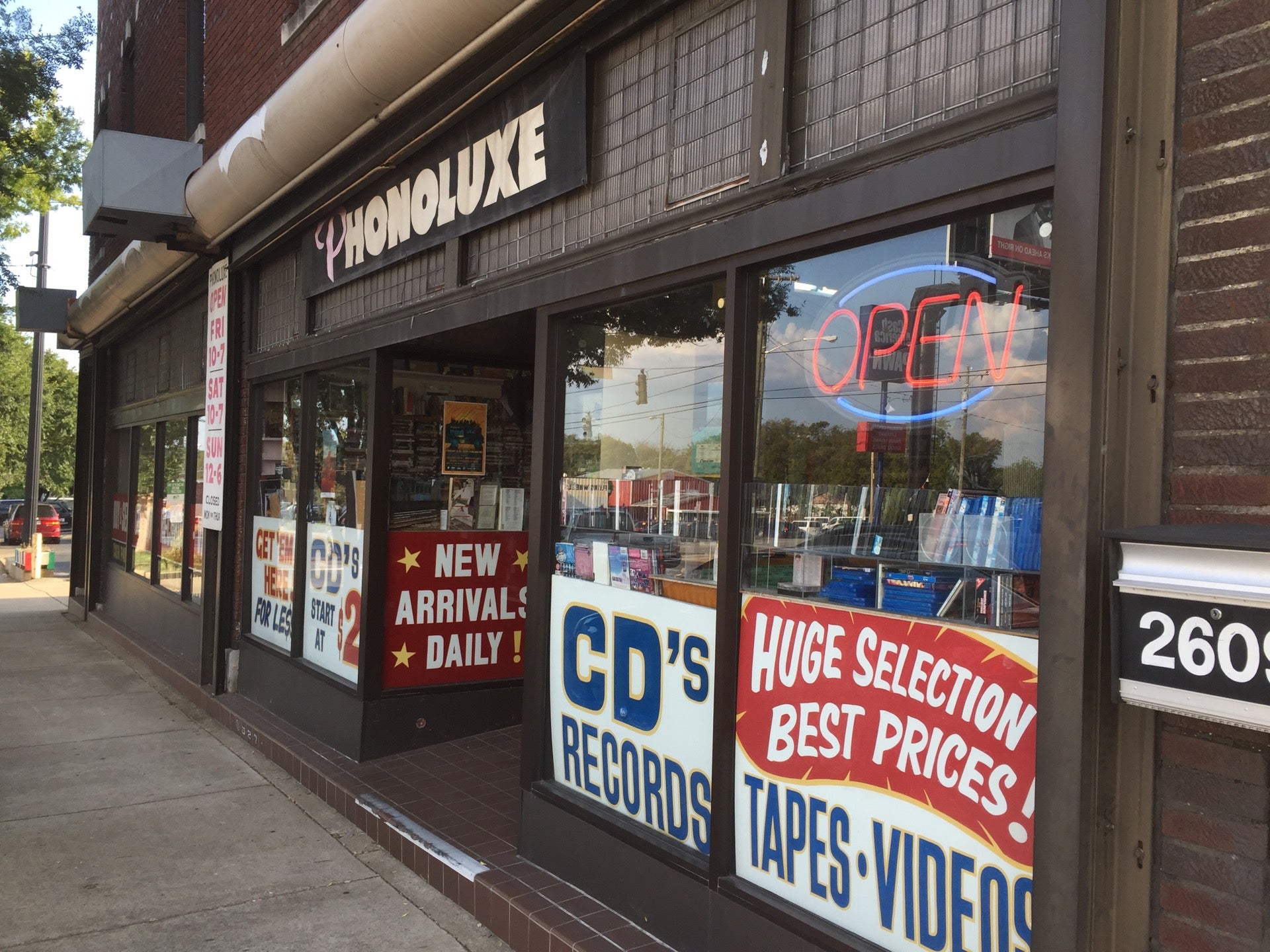 Phonoluxe storefront on Nolensville Pike with record and CD signs in the windows